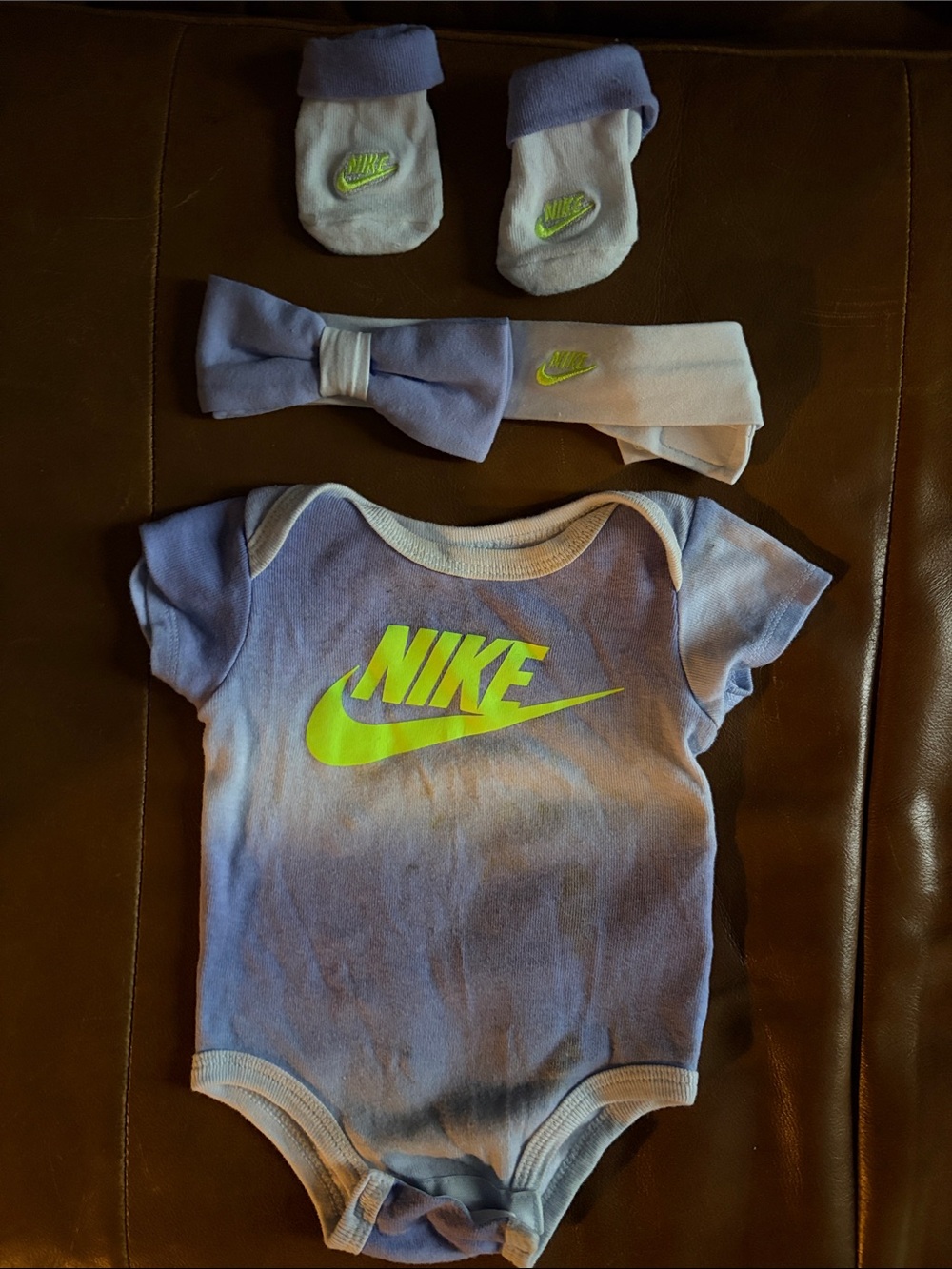 Nike Baby One-Piece Bodysuit in Light Purple with Neon Logo